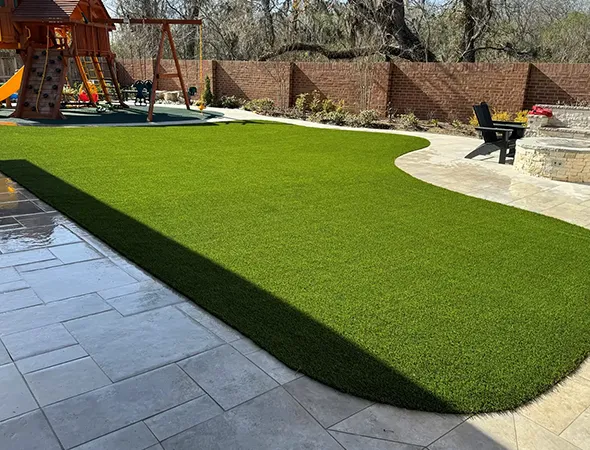 Durable synthetic turf play surface around playground equipment in Suwanee, GA