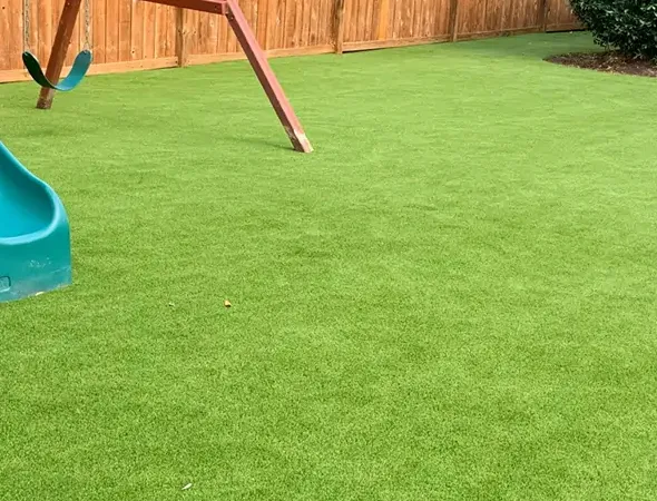 Accessible turf surfacing around outdoor playground equipment in Suwanee, Georgia
