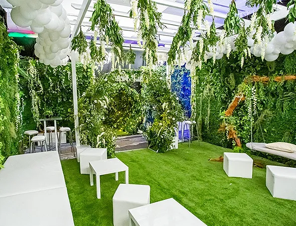 Outdoor bar and brewery patio featuring low-maintenance artificial grass