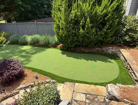 Pet-friendly artificial turf installed in a Johns Creek, GA backyard