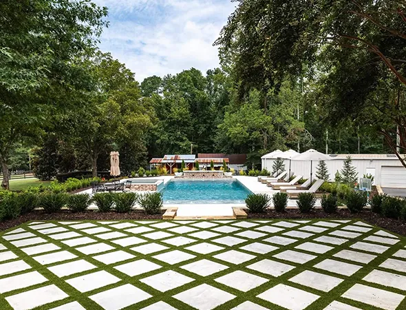 Artificial turf creating a comfortable poolside surface for bare feet