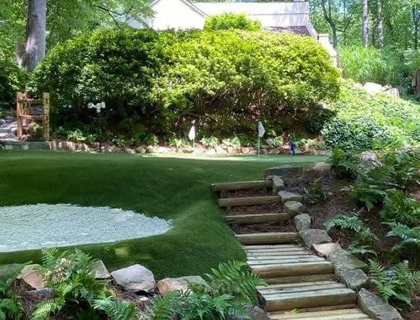 Residential artificial grass surrounding a backyard patio in Roswell, GA