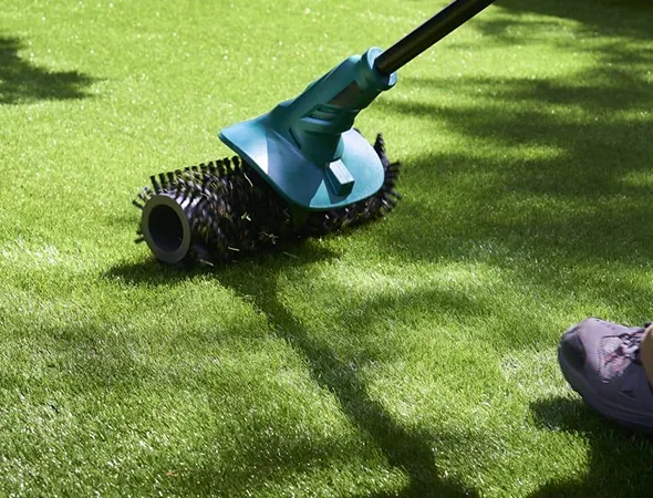 Synthetic turf restoration for worn and aging lawn surfaces